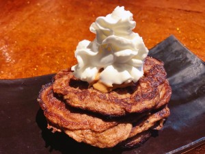 Pancakes on plate with whipped cream