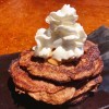 Pancakes on plate with whipped cream