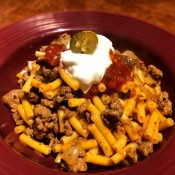 Taco Mac n Cheese topped with sour cream & salsa