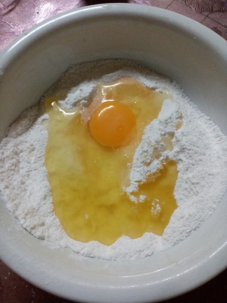adding egg to flours