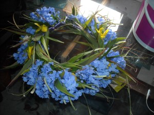 Christmas Flower Crown - finish adding flowers and leaves around to the end of the base, tie off with the ribbon and cut off excess