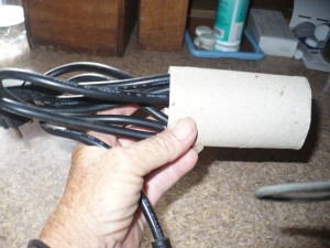 Organizing and Storing Laptop Cables - slide the cable into the paper towel tube