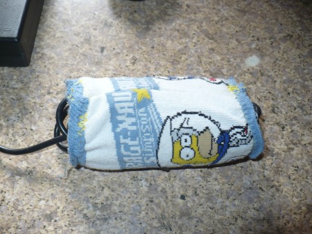 Organizing and Storing Laptop Cables - store the power supply and its cable in a sock with a tube already inserted