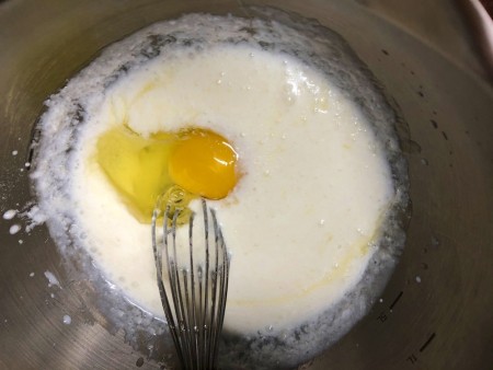 adding egg to milk mix