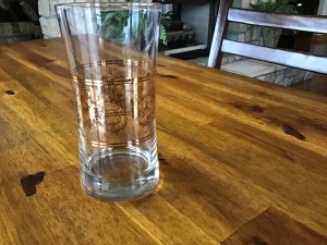 Identifying a Old Drinking Glass - clear glass with a band of swirly leaf garlands around the middle