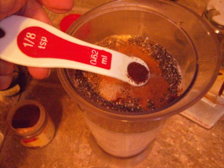 adding spices to blender