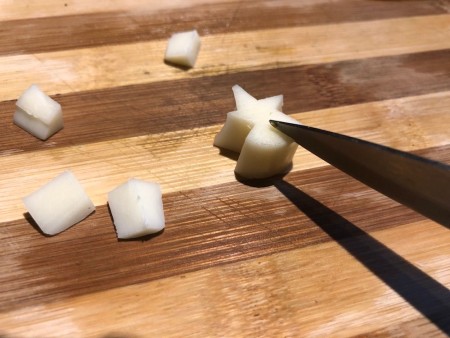 Veggie and Cheese Christmas Trees - cutting stars from the cheese