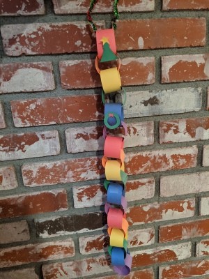 Rainbow Christmas Countdown - countdown hanging on a brick fireplace