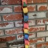Rainbow Christmas Countdown - countdown hanging on a brick fireplace