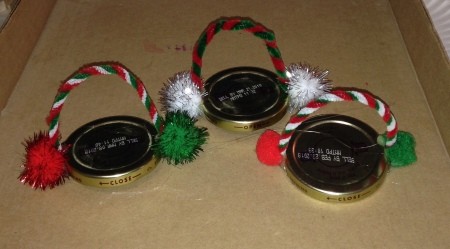 Pasta Jar Snowman Luminaries - pom poms glued in place at the end of the pipe cleaners