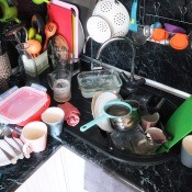 A messy and cluttered kitchen counter.
