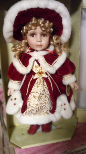 Value of a Collectible Memories Doll - doll in a red velvet coat with white fur trim