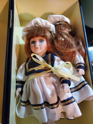 Value of DanDee Porcelain Dolls - two dolls wearing sailor style dresses in a box