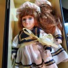 Value of DanDee Porcelain Dolls - two dolls wearing sailor style dresses in a box