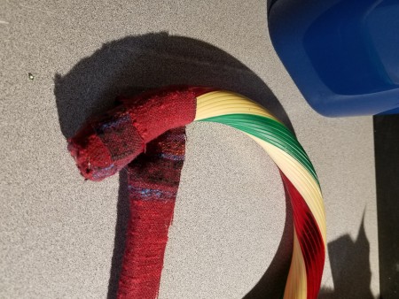 Ripped Fabric Wrapped Faux Candy Canes  - begin wrapping diagonally