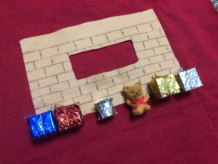 DIY Animated Christmas Hearth Shirt - hot glue the toys and packages to the hearth area or use double sided tape