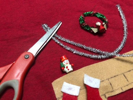DIY Animated Christmas Hearth Shirt - hot glue one side of the garlands down and weight it down, with something like scissors
