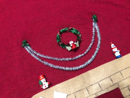 DIY Animated Christmas Hearth Shirt - tiny pieces of twisted green tinsel pipe cleaner added to the ends of the garland