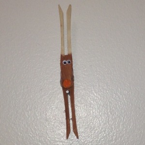 Clothespin Reindeer  - reindeer ornaments hanging on the wall