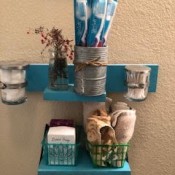 A set of organized small shelves in a bathroom.
