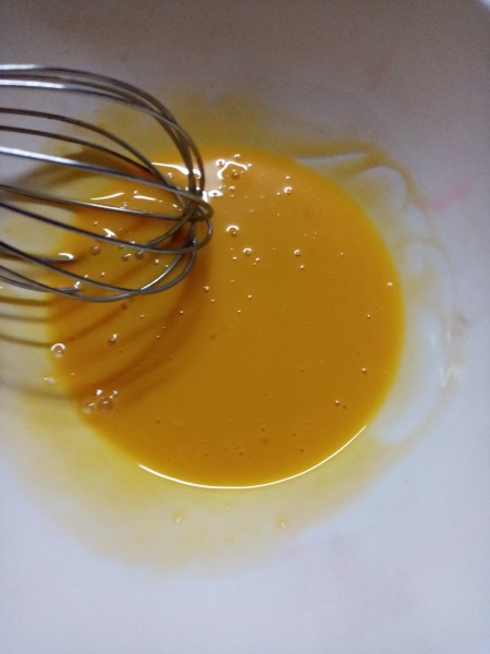 whisking egg yolk