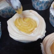 piping filling into meringue Cups