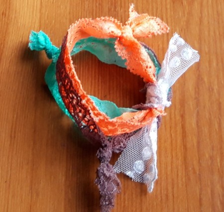 Lace Wristband - tie short lengths of fourth color and tie half way between the knots