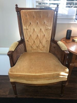 Identifying a Vintage Chair - wooden armed chair with upholstered back and cushion, and caned sides below the arms