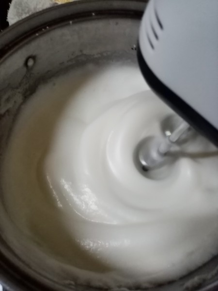 Mixing the meringue batter.