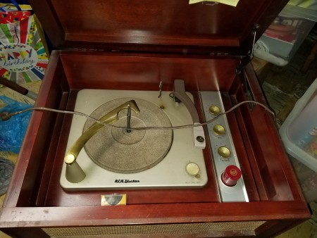 Value of a RCA Victor Cabinet Record Player - cabinet with top open to show the turntable