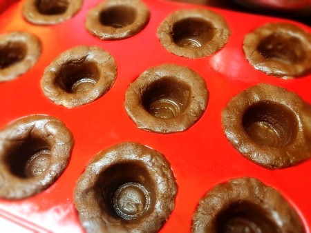 unbaked cookie mugs in cupcake tin