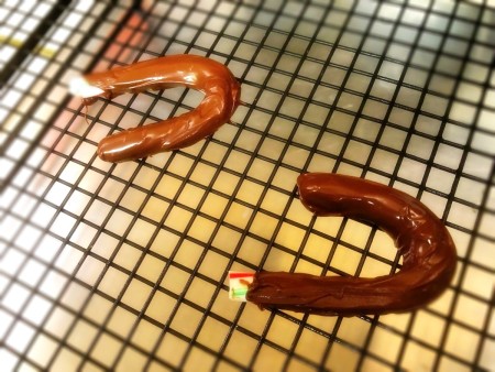 dipped chocolate handles drying on rack