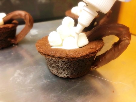 marshmallows & icing on top of Mug Cookies