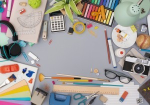 A desk filled with craft supplies.