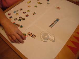 A game board being used to assemble a puzzle.