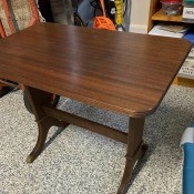 Identifying a Side Table - rectangular table with rounded corners, routed edge and legs, with brass feet caps