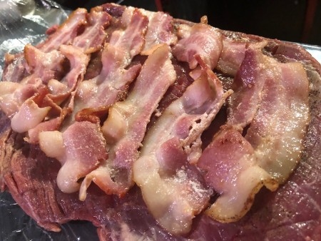 cooked bacon added to steak