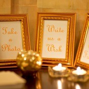 A collection of picture frames at a wedding reception.