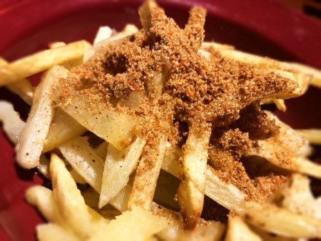 mixing spices in Fries