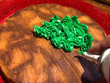 UFO Cow Abduction Cake - apply wispy grass frosting to the top fo the third cake, leave the sides clear