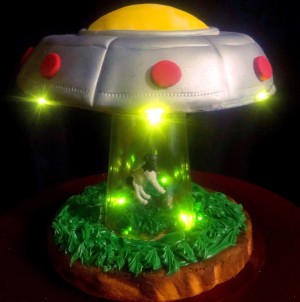 UFO Cow Abduction Cake - finished cake photo shot against a black backdrop