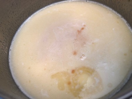 milk with melted butter in pan