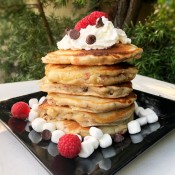 Raspberry Marshmallow Chocolate Chip Pancakes stacked on plate