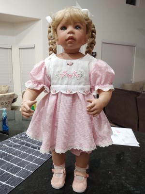 Identifying a Porcelain Doll - doll with blond braids and a pink dress