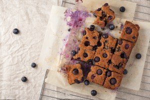 Blueberry cake cut into squares.