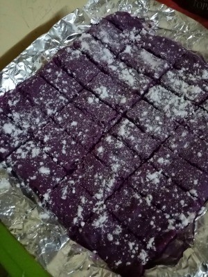 baked Purple Cookie Bars dusted with powdered sugar