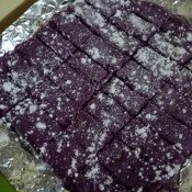 baked Purple Cookie Bars dusted with powdered sugar