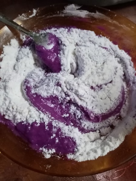 adding flour to batter