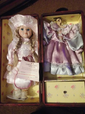 Value of a Cathay Depot Collection Doll - doll in case with clothes hanging on the other side