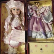 Value of a Cathay Depot Collection Doll - doll in case with clothes hanging on the other side